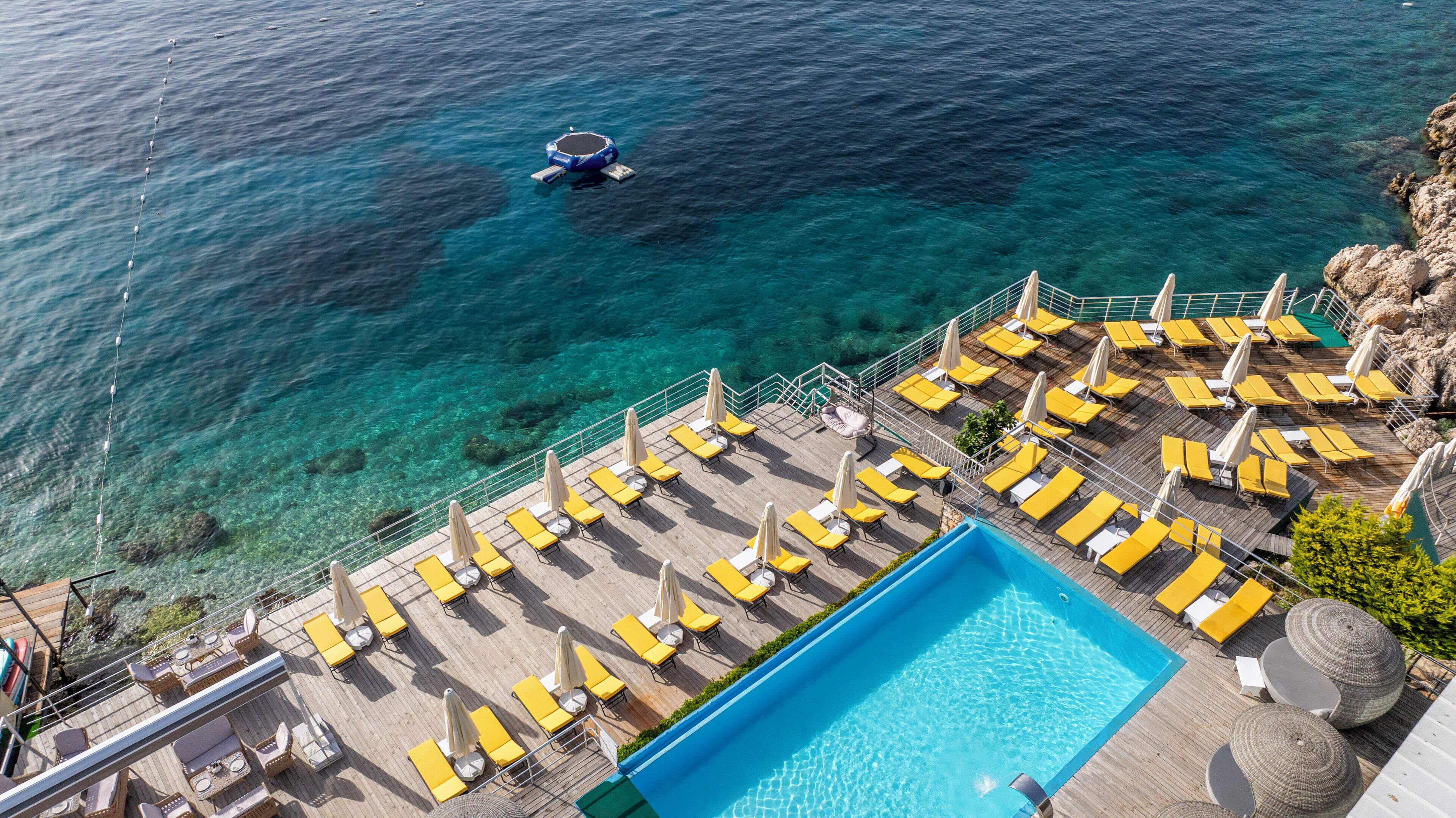 outdoor pool, pool umbrellas, pool loungers