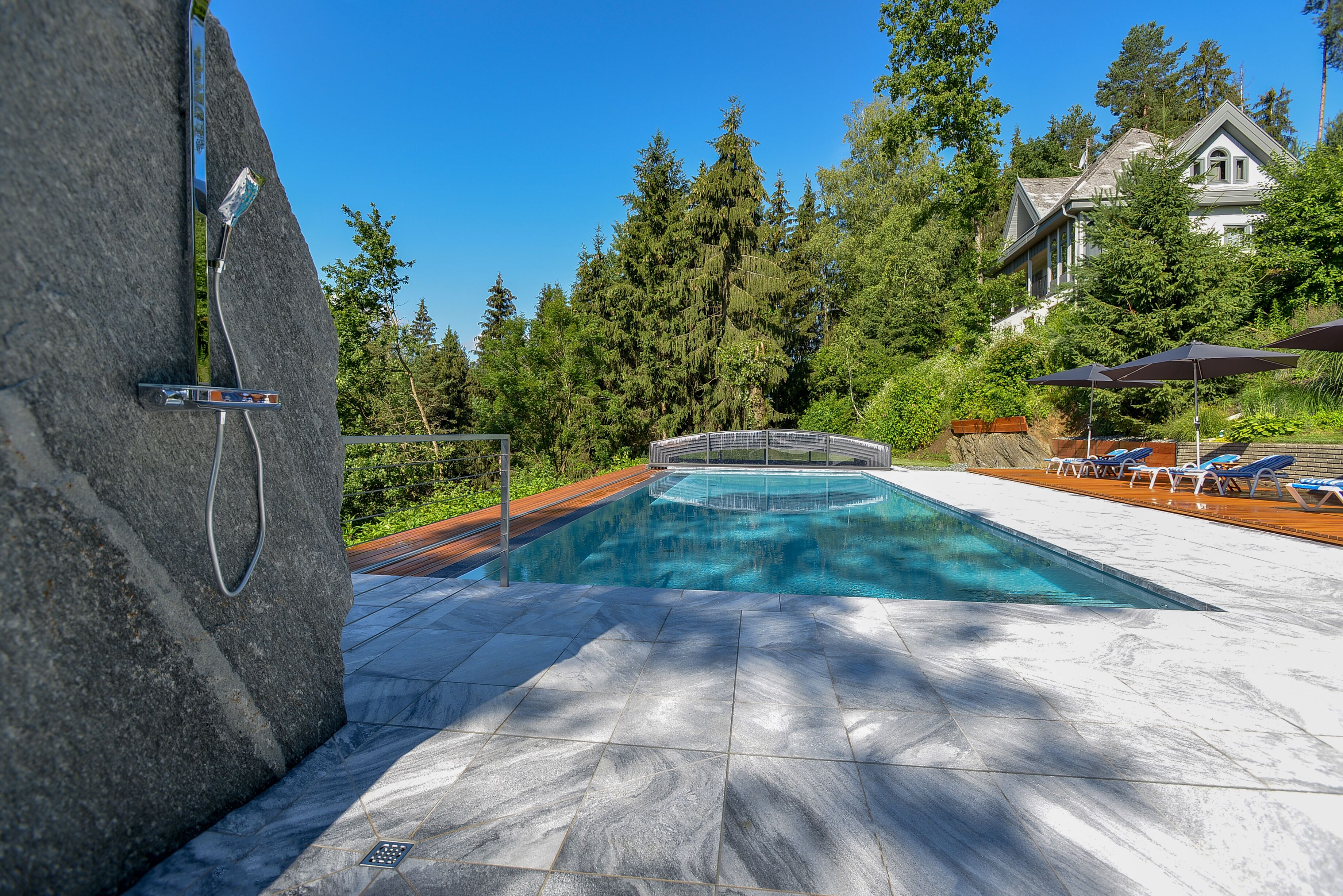 outdoor pool, pool umbrellas, pool loungers