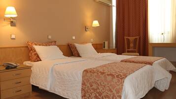 Twin Room | Minibar, in-room safe, iron/ironing board, free WiFi