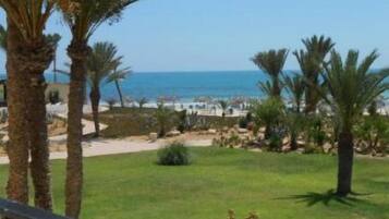 On the beach, sun loungers, beach umbrellas, beach towels