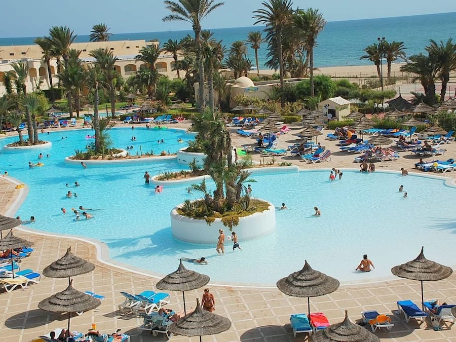 Indoor pool, 3 outdoor pools, open 6 AM to 7 PM, pool umbrellas