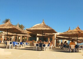 On the beach, sun loungers, beach umbrellas, beach towels