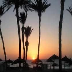 On the beach, sun loungers, beach umbrellas, beach towels