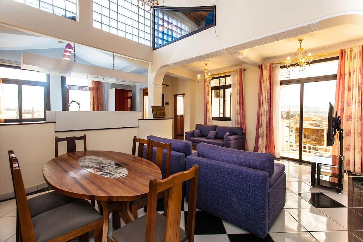 Suite, 4 Bedrooms | Living area | Flat-screen TV