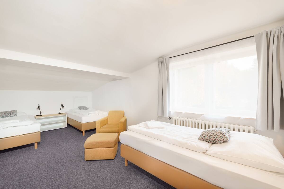 two bedroom apartment with living room | desk, blackout curtains, iron/ironing board, free cots/infant beds