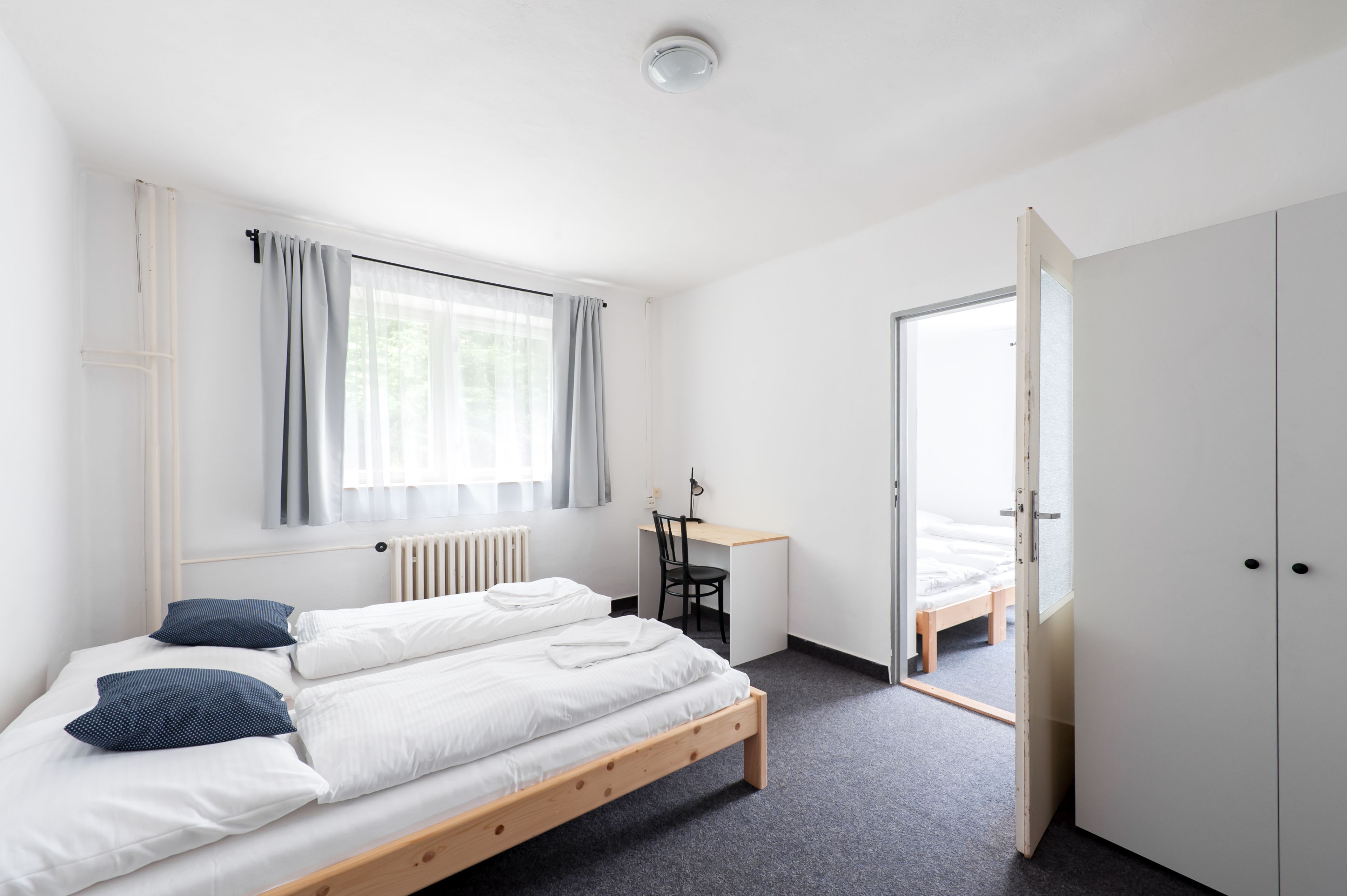 desk, blackout curtains, iron/ironing board, free cots/infant beds