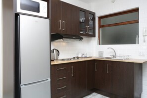 Basic Studio, 1 Bedroom, City View, Sea Facing | Private kitchen | Full-size fridge, microwave, stovetop, coffee/tea maker - Studio in the Park (Cape Town)