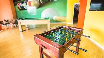 Enjoy games and entertainment in this lively indoor space featuring a foosball table and pool table.