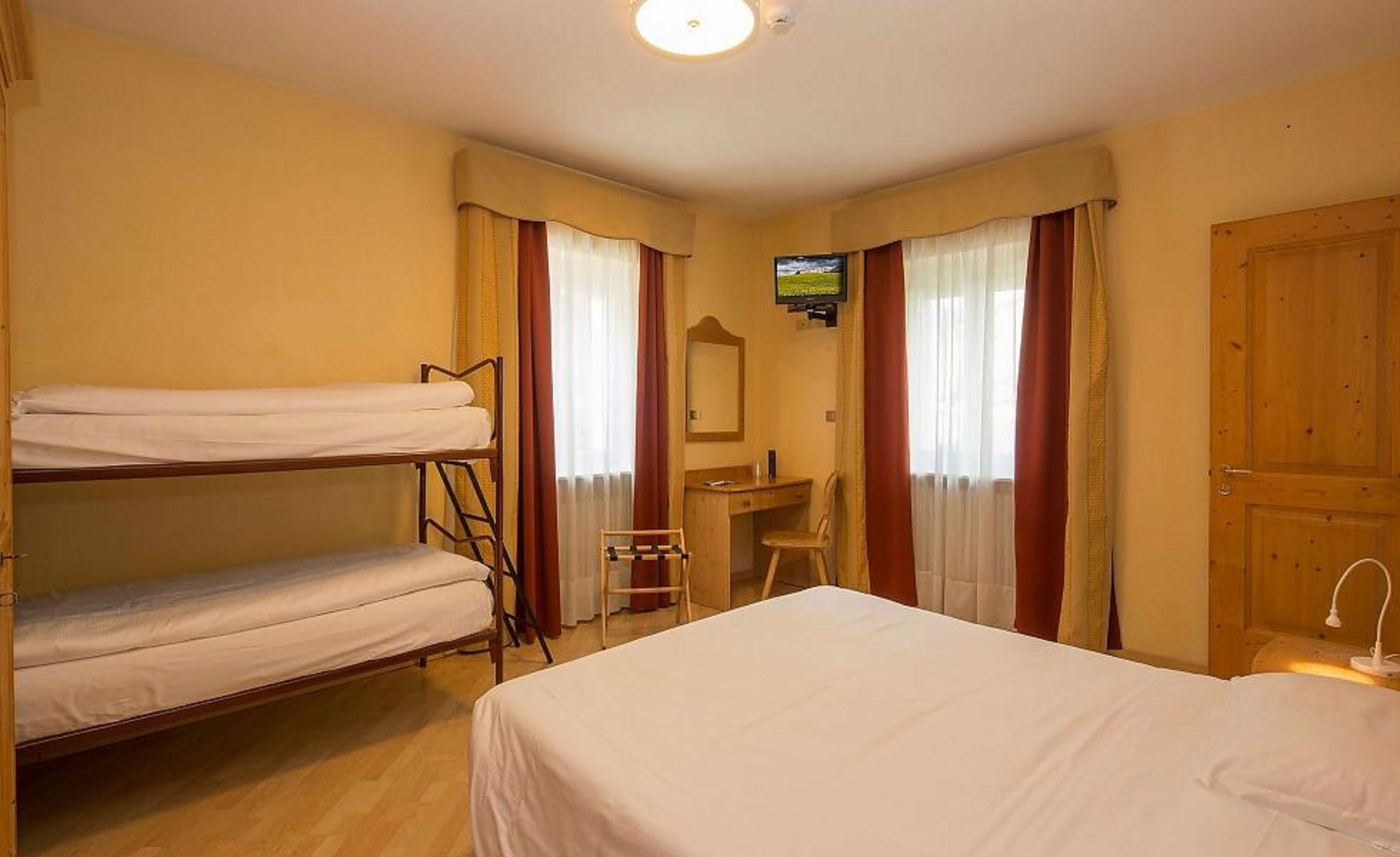 quadruple room | in-room safe, desk, blackout curtains, free wifi