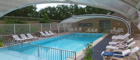 Outdoor pool, a heated pool, pool umbrellas, sun loungers