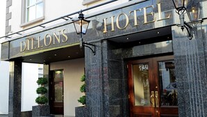 A hotel entrance with a sign reading "DILLONS HOTEL". - Dillons Hotel (Letterkenny)