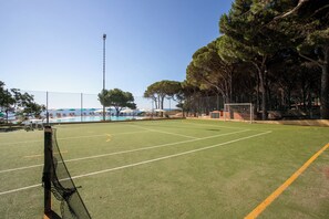 A soccer field with goalposts, surrounded by trees and a fence. - Club Hotel Marina Seada Beach (Budoni)