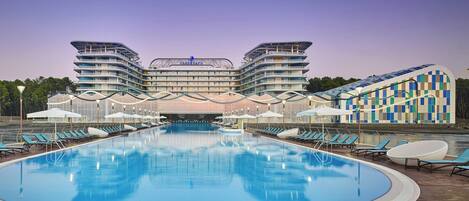 Indoor pool, outdoor pool, pool umbrellas, pool loungers