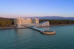 Indoor pool, outdoor pool, pool umbrellas, pool loungers