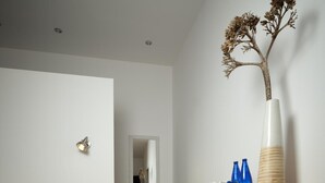 A bedroom with a bed, bedside table, dresser, and a mirror. - S'hort den Carrio (Ses Salines)