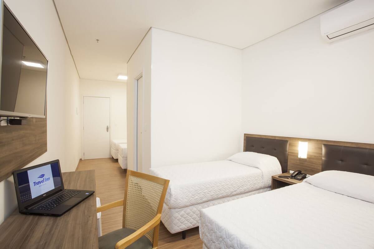 Standard Quadruple Room, Multiple Beds | Minibar, WiFi (free), bed sheets