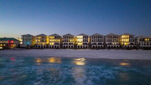 A beachfront hotel with multiple buildings, each featuring balconies and a pool area. - Frangista Tide*All New Furnishings*Pool*BeachSvc+Gear (Miramar Beach)