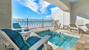 A pool area with lounge chairs and a view of the ocean. - Frangista Tide*All New Furnishings*Pool*BeachSvc+Gear (Miramar Beach)