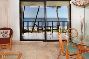 Enjoy the view from your outdoor space, which offers a comfortable seating area with a table and chairs.