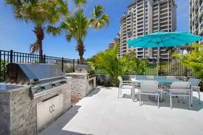 Relax and dine al fresco in our outdoor patio, featuring a barbecue grill and comfortable seating area.