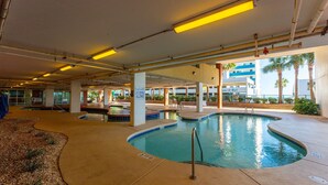 An indoor swimming pool with a sign indicating shallow water and no diving allowed. - Luxury condo, across the street from the beach + Free Attraction Tickets! (North Myrtle Beach)