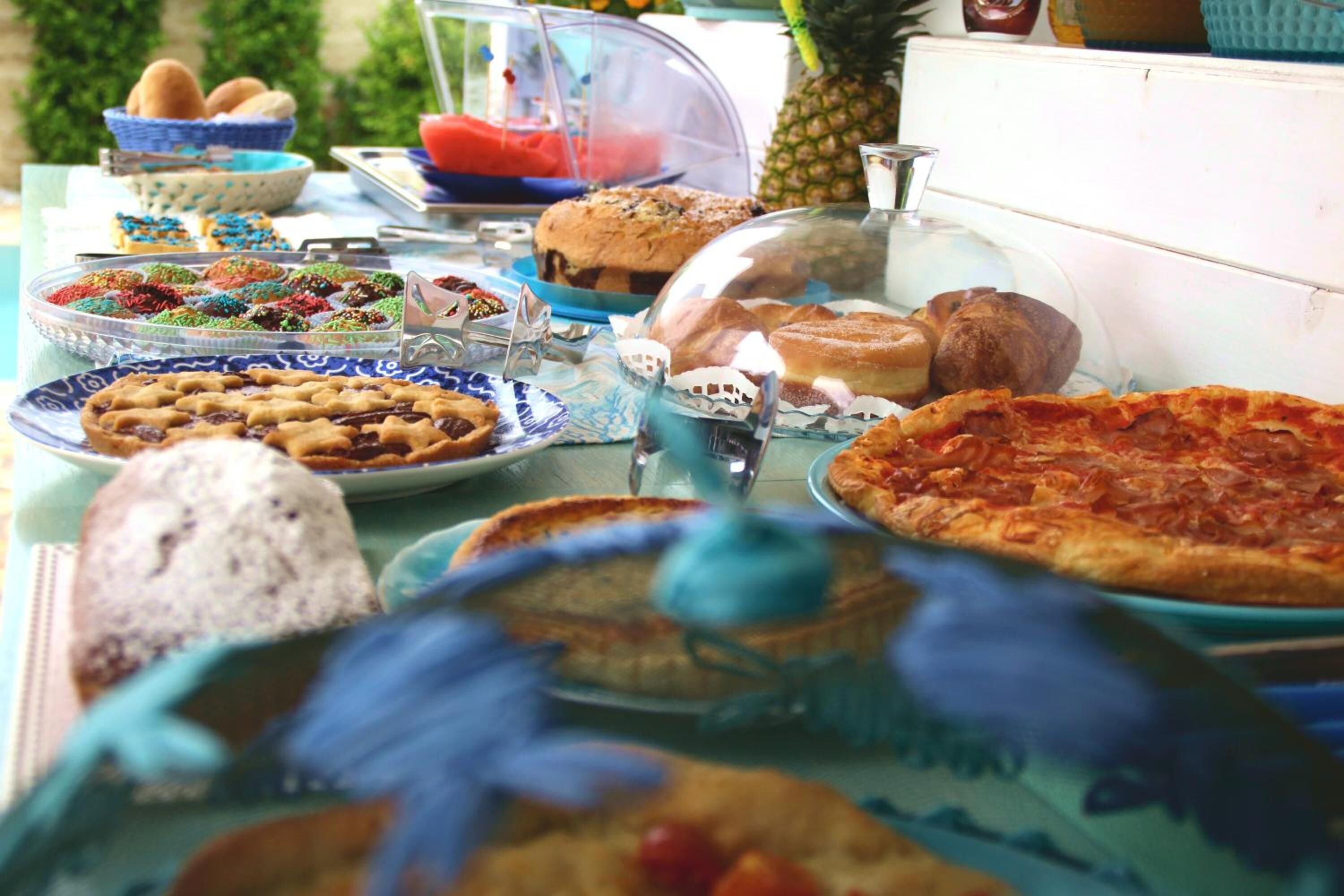 A buffet table with various baked goods and desserts.