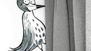 Ilustración de un pájaro sobre tela con estampado de cuadros.