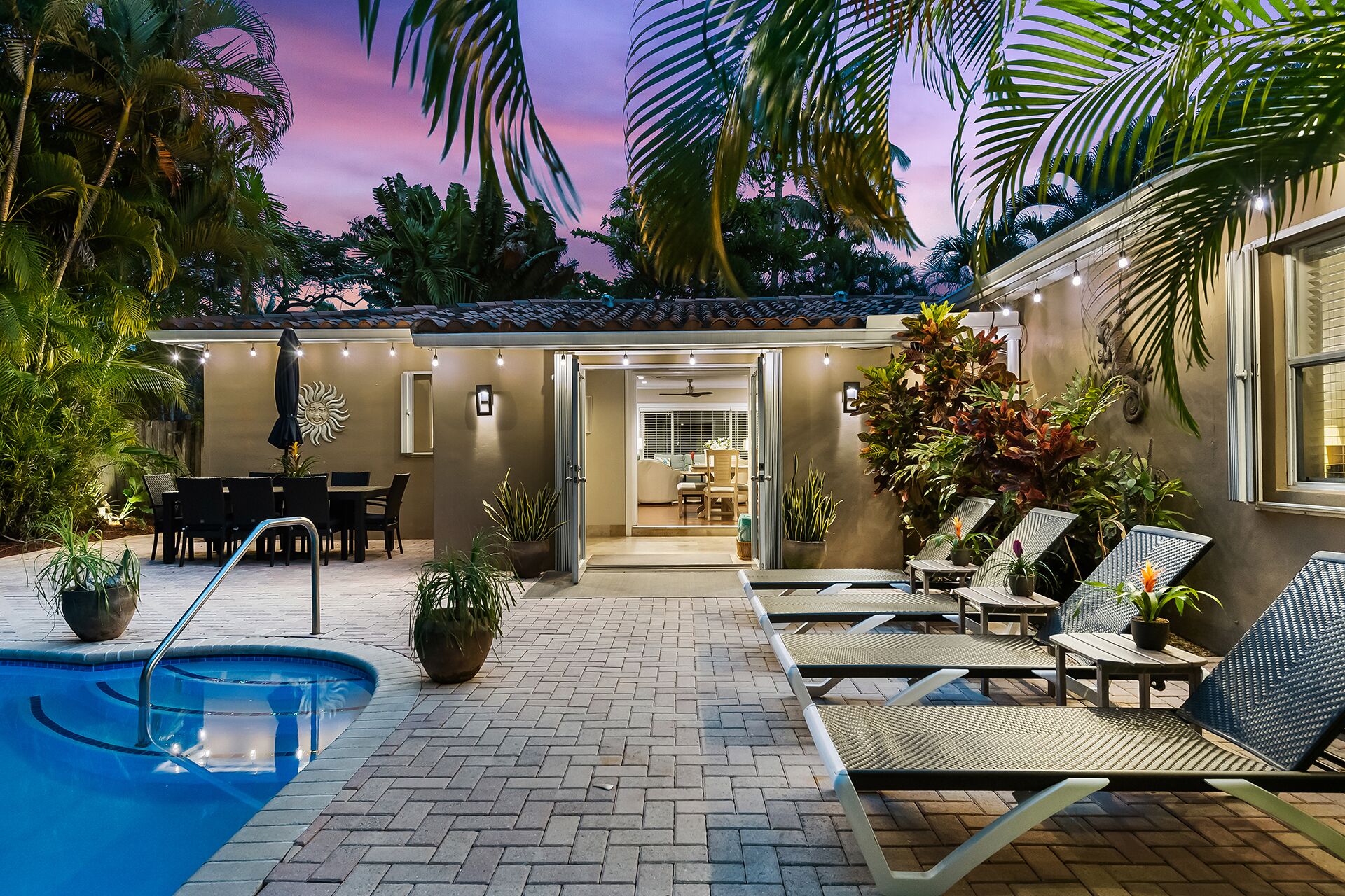 A heated pool, sun loungers