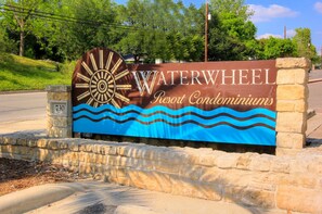 Welcome to Waterwheel Resort Condominiums, where the iconic waterwheel logo greets you.