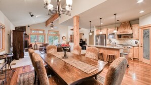 A spacious kitchen with wooden cabinets, a large island, and modern appliances. - Olive 4 BR Private Hot Tub, Fenced Yard, Pet-Friendly, Walk to Lake (Carnelian Bay)