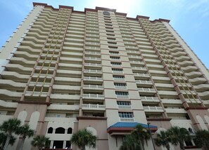 Stunning high-rise building with spacious balconies and a symmetrical facade.