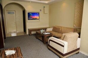 Royal Suite | Living area | 42-inch LED TV with satellite channels, TV -  La Rive Hotels & Suites (Formerly known as Ghosn Al Banafsej) (Dammam)