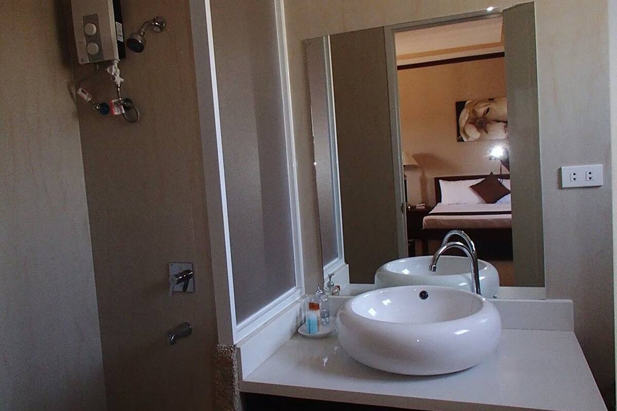 super deluxe family room | bathroom | shower, free toiletries, bidet, towels