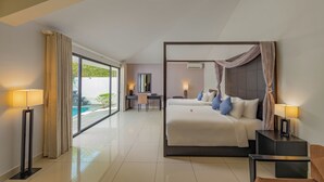 A modern hotel room with a large bed, a desk, and a view of a swimming pool. - Grandvrio Ocean Resort Danang (Da Nang)