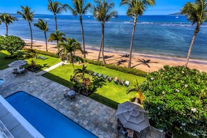A pool area with a view of the beach and ocean. - Peaceful Oceanfront Studio 423 LS (Lahaina)