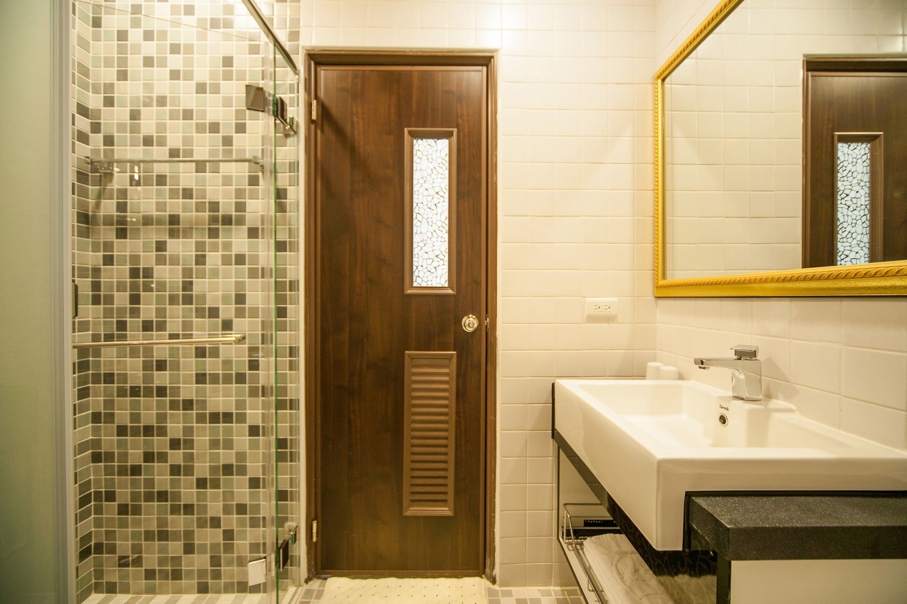 shower, hair dryer, slippers, towels