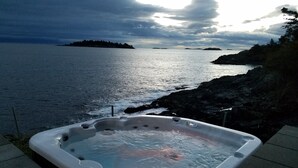 A hot tub by a rocky coastline with a view of the sea and distant islands. - UNIQUE RESIDENTIAL OCEANFRONT PROPERTY ON VANCOUVER ISLAND  (Nanoose Bay)