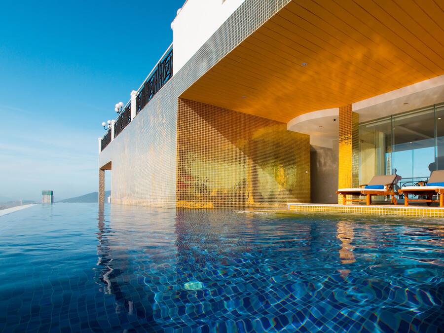 Outdoor pool, open 6 AM to 9 PM, pool umbrellas, pool loungers