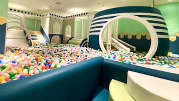 Kids can play in the ball pit and climb the circular structure.