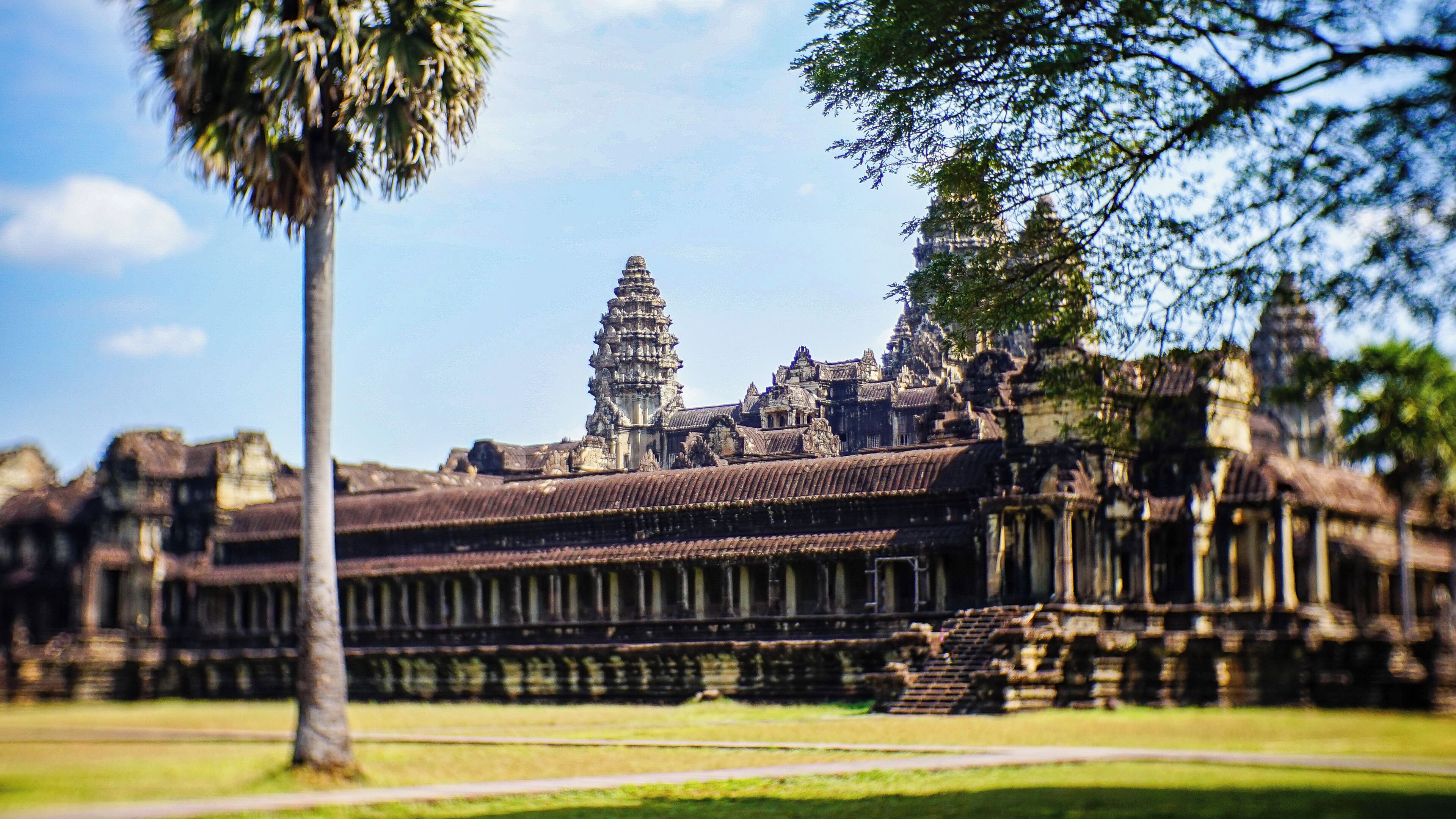A historical temple complex with intricate architecture, including tiered towers and detailed carvings.