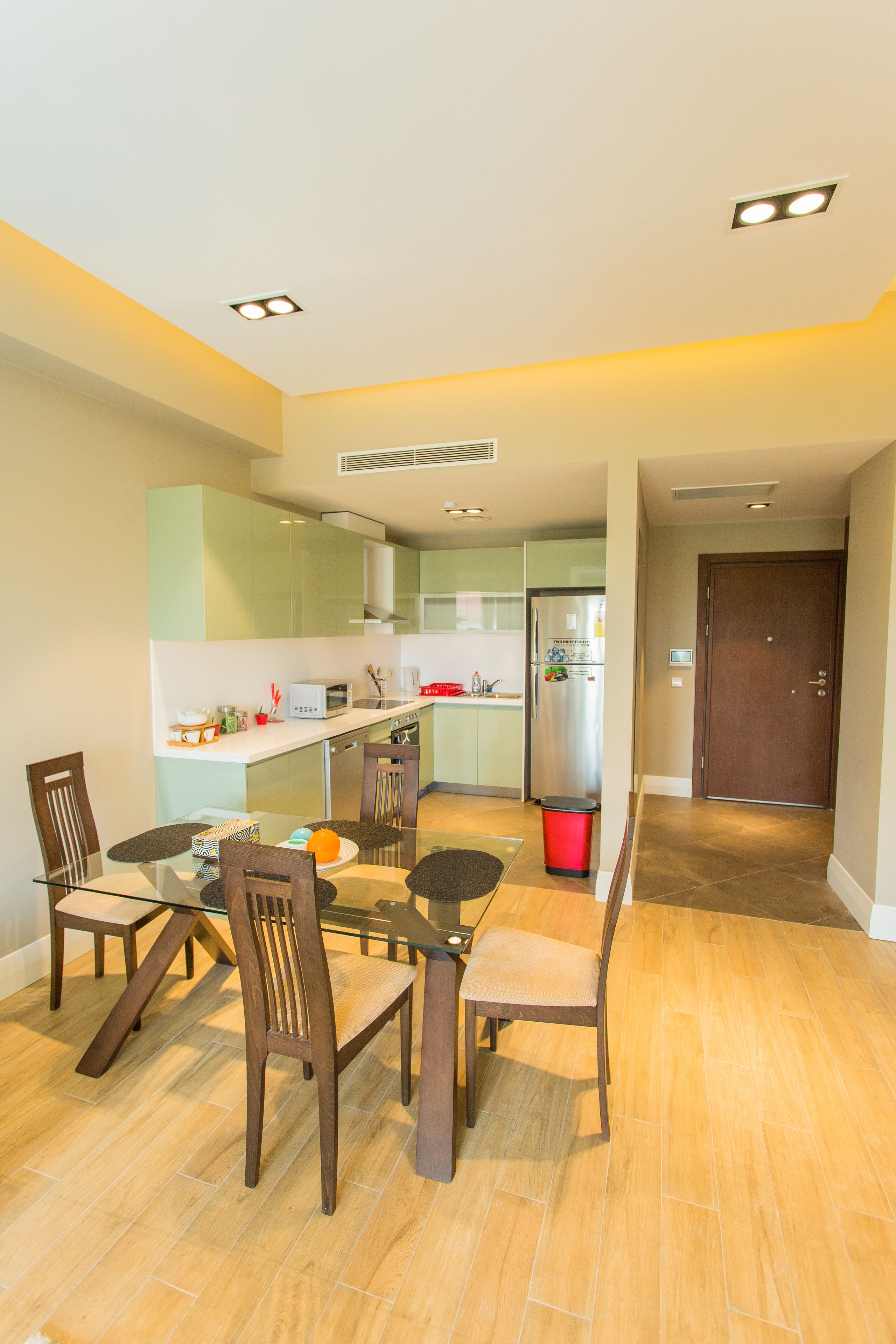 A modern kitchen with a dining area.
