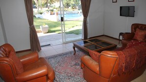 Family Cottage, 1 Bedroom, Pool View | Living room - Private Cottages (Sandton)