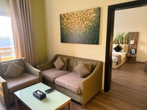 Deluxe Suite | Minibar, in-room safe, desk, iron/ironing board - Royal View Hotel (Ras Al Khaimah)
