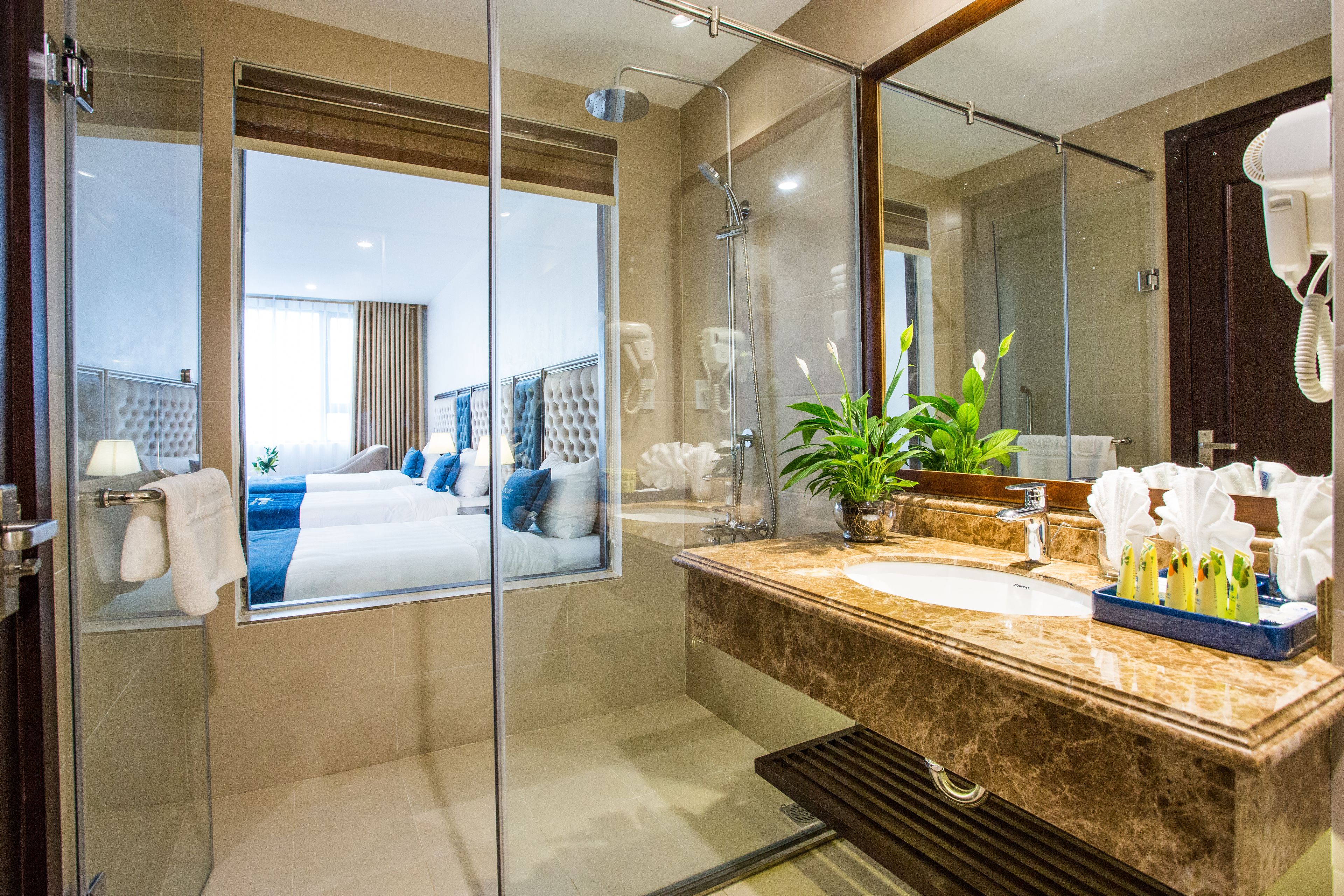grand deluxe triple room | bathroom | shower, free toiletries, hair dryer, bathrobes
