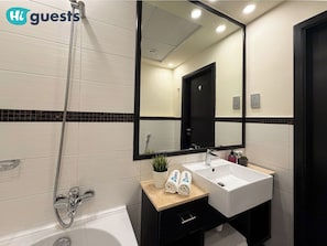 Superior Studio, 1 Queen Bed, City View | Bathroom | Shower, free toiletries, hair dryer, slippers