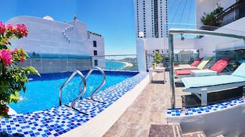 Outdoor pool, open 6:00 AM to 10:00 PM, pool loungers