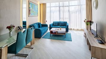 Deluxe Apartment, 1 Bedroom | Living area | TV