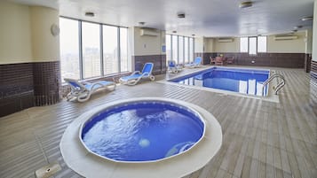 Indoor pool, a rooftop pool, open 8 AM to 11:00 PM, sun loungers