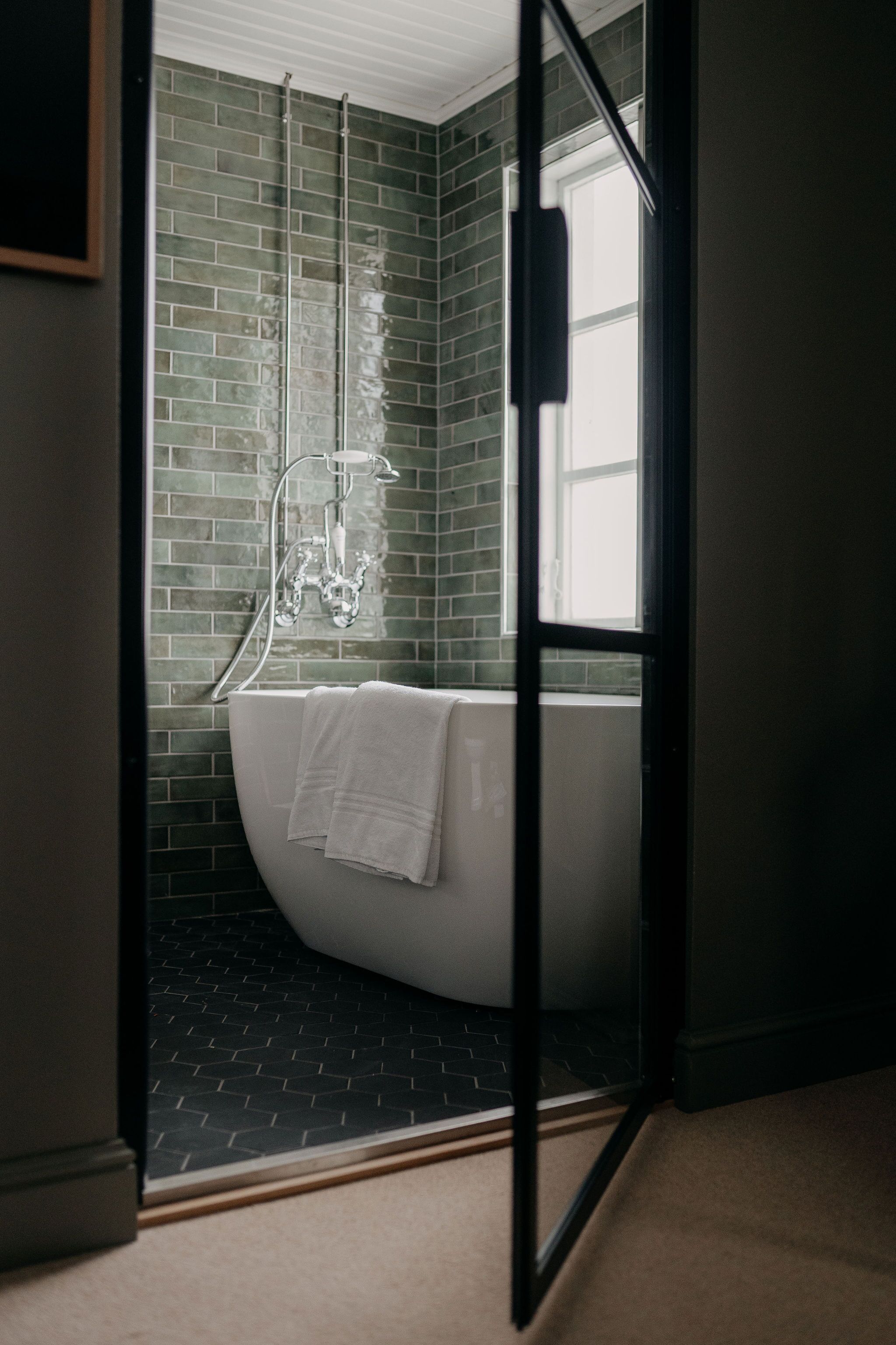 designer toiletries, hair dryer, bathrobes, slippers