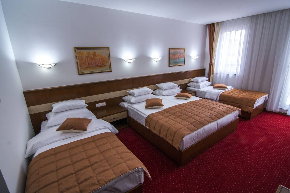 Quadruple Room | Minibar (free items), in-room safe, desk, soundproofing